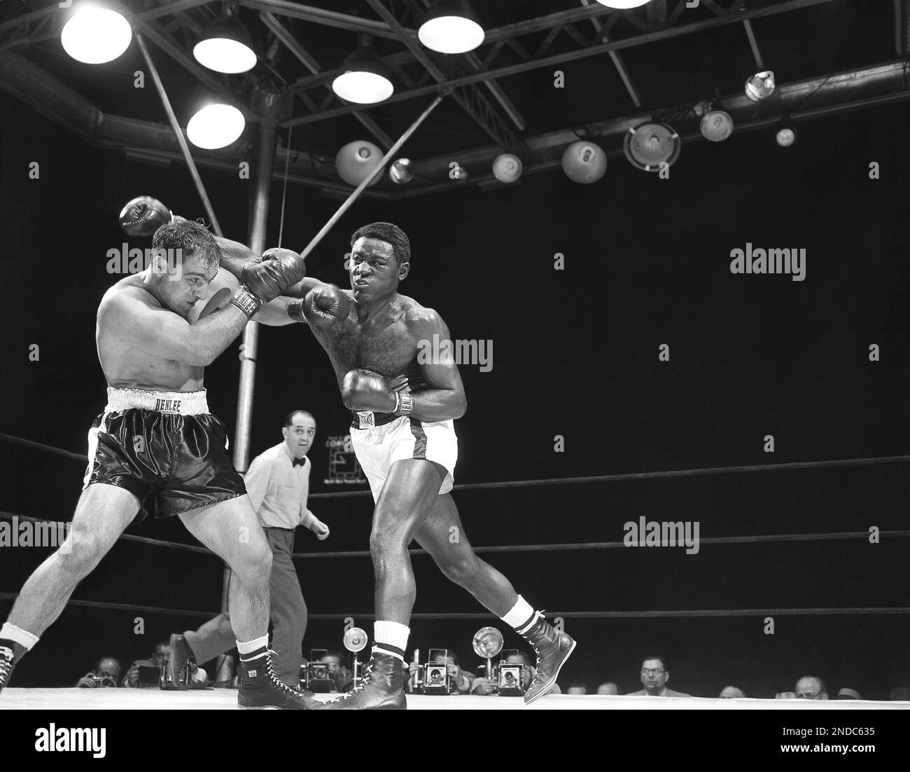 Ezzard Charles Screws Up His Face As He Takes A Left To The Chin By ezzard-charles-screws-up-his-face-as-he-takes-a-left-to-the-chin-by
