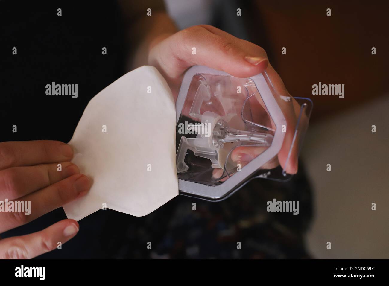 Picture of Opening the packaging of the blood glucose sensor Stock Photo - Alamy