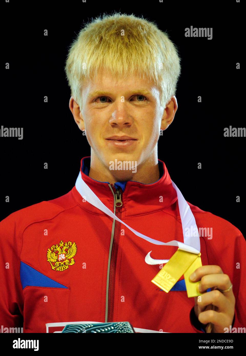Russia's Stanislav Emelyanov poses with his gold medal during the
