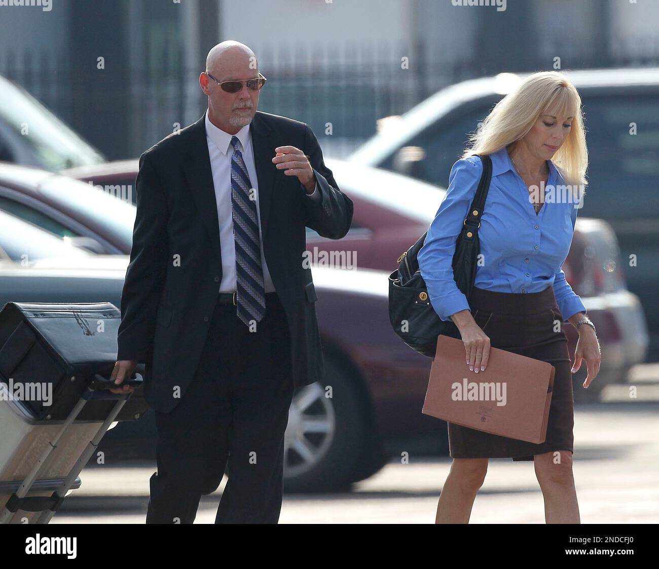 Karen Cunagin Sypher arrives with her attorney James Earhart at the federal  courthouse for the second day of her trial in Louisville, Ky., Tuesday,  July 27, 2010. Sypher is accused of trying