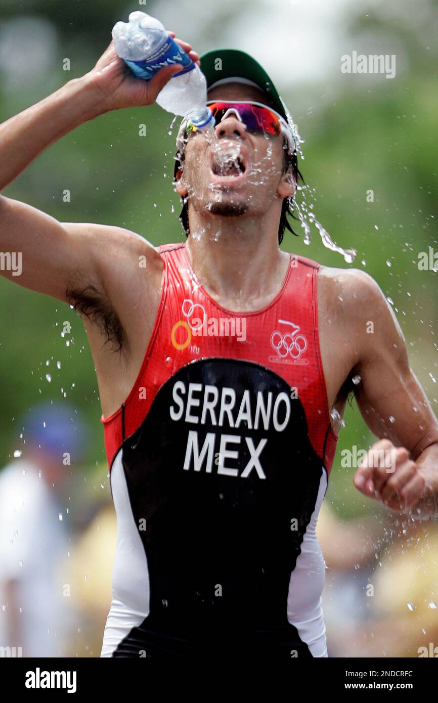 Mexico’s Francisco Serrano drinks water during the running leg of the