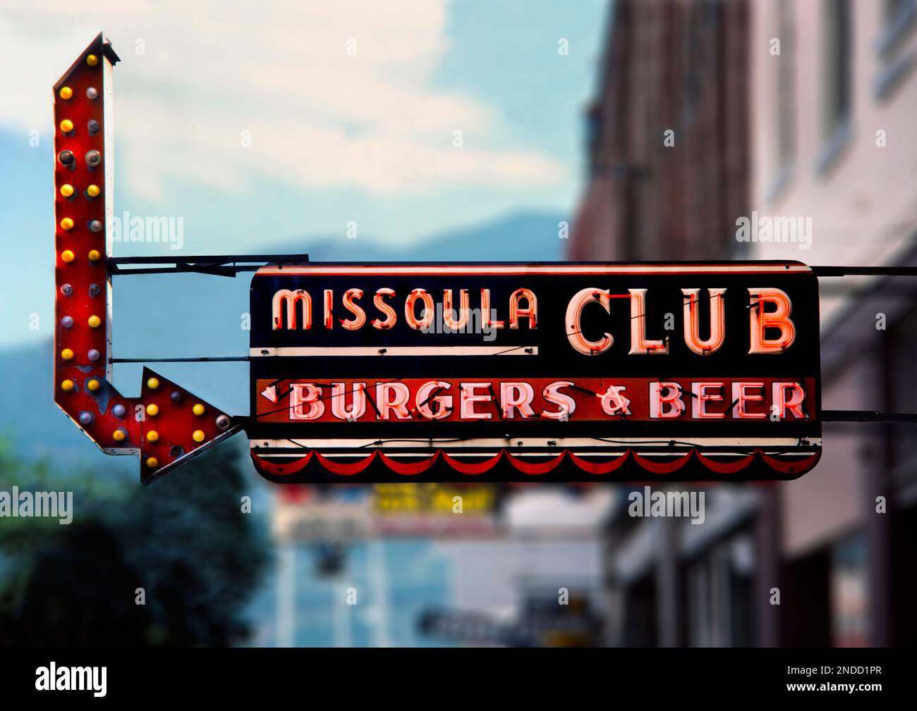 Neon sign advertising burgers & beer at the Missoula Club sports bar in downtown Missoula, Montana.  The historic Missoula Club is known for its hambu Stock Photo