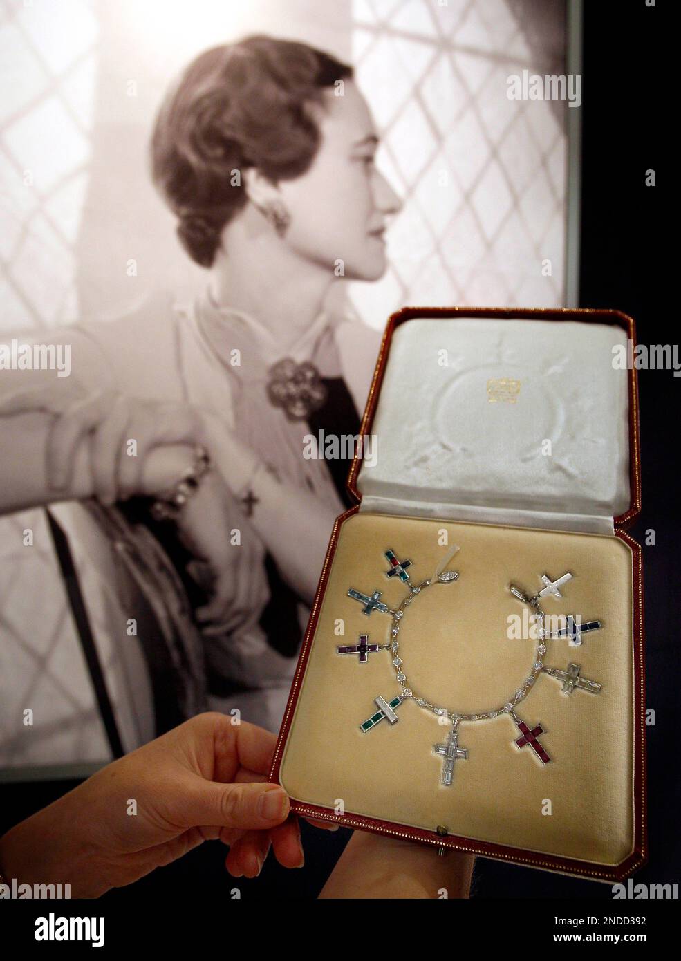 A diamond bracelet by Cartier, that once belonged to Wallis Simpson, is  seen displayed in front of a Cecil Beaton portrait of her at Sotheby's  auction rooms in London, Thursday, July 22,