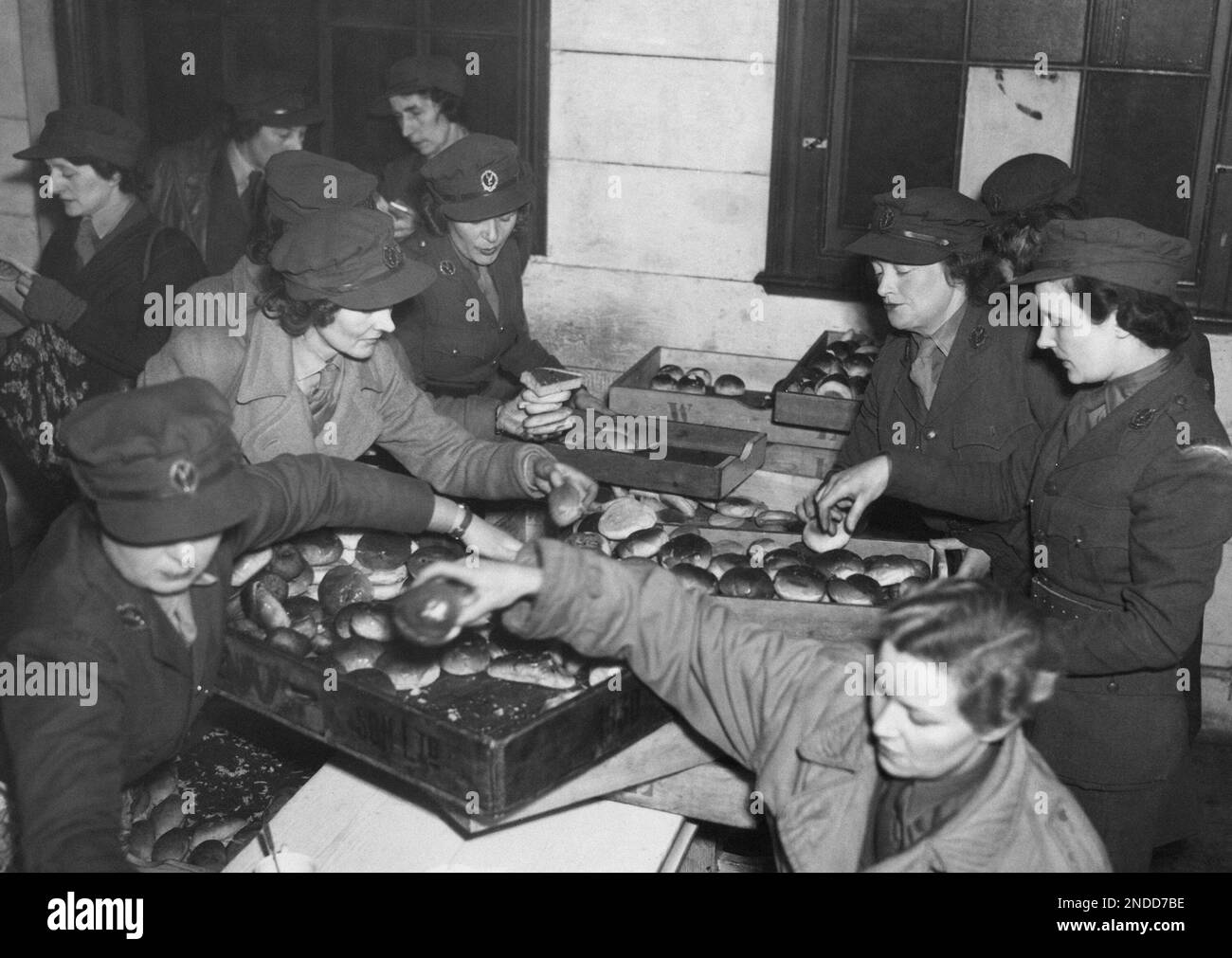 A busy scene in the dockside hut headquarters of the Legion, in London