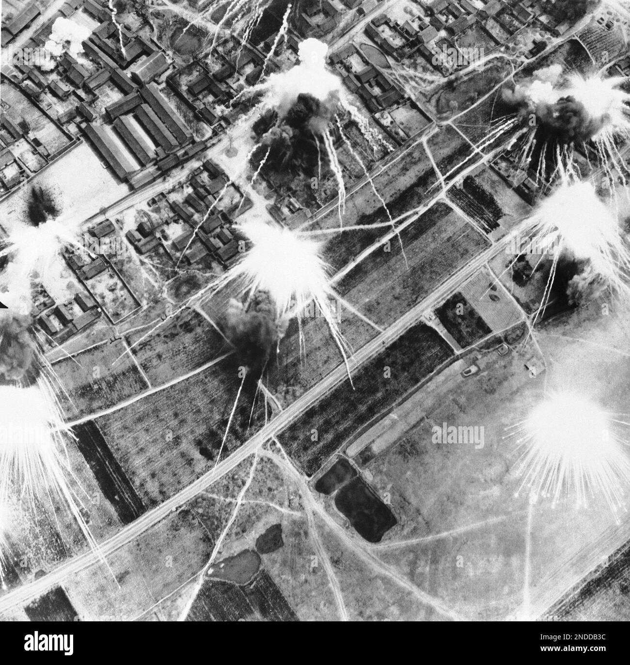 Exploding bombs form patterns as they are dropped on military ...