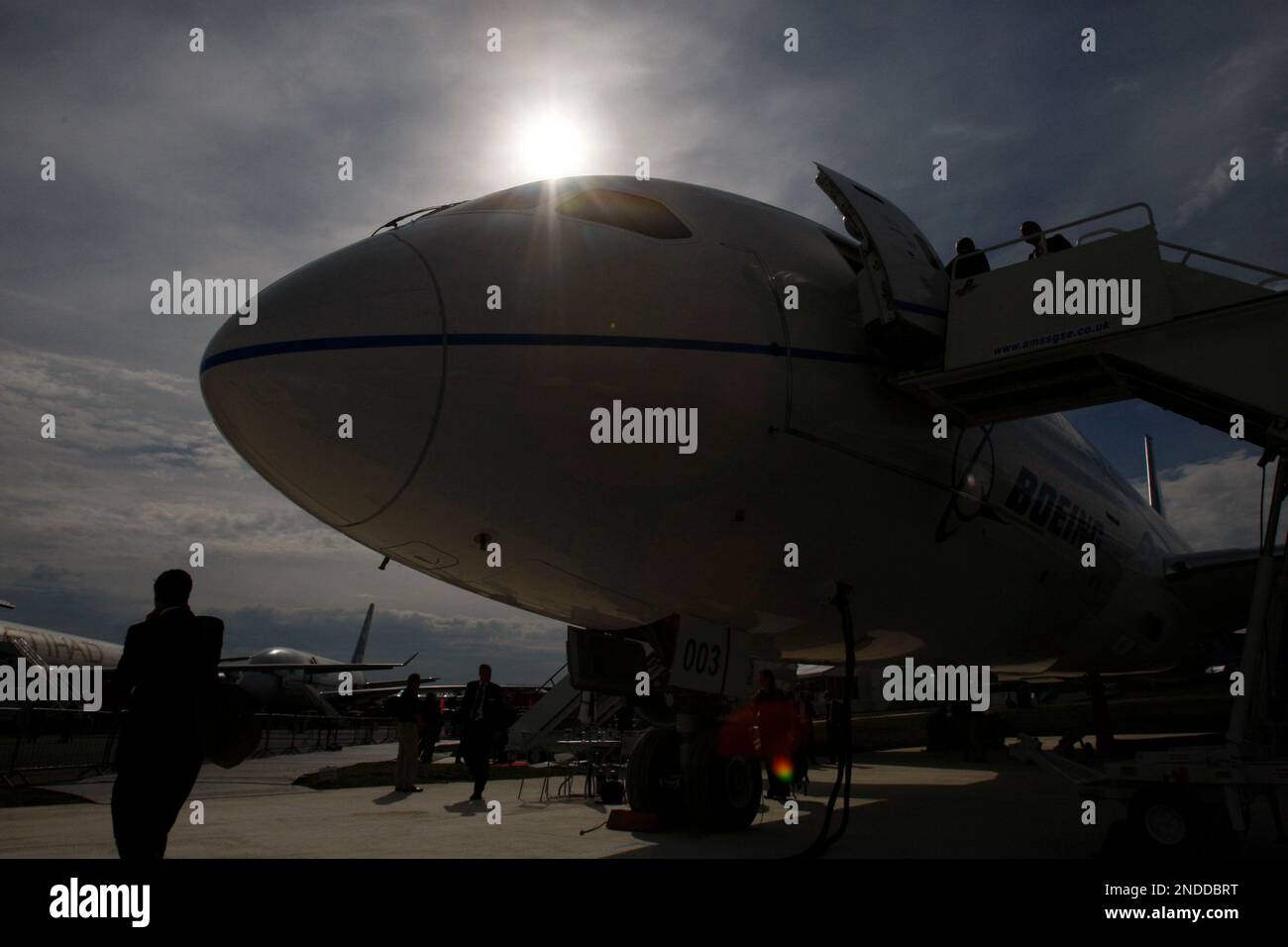 Visitors looks at a Boeing 787 Dreamliner on display at the Farnborough