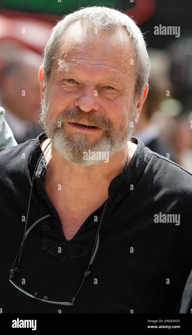 Director and writer Terry Gilliam poses for a photograph as he arrives