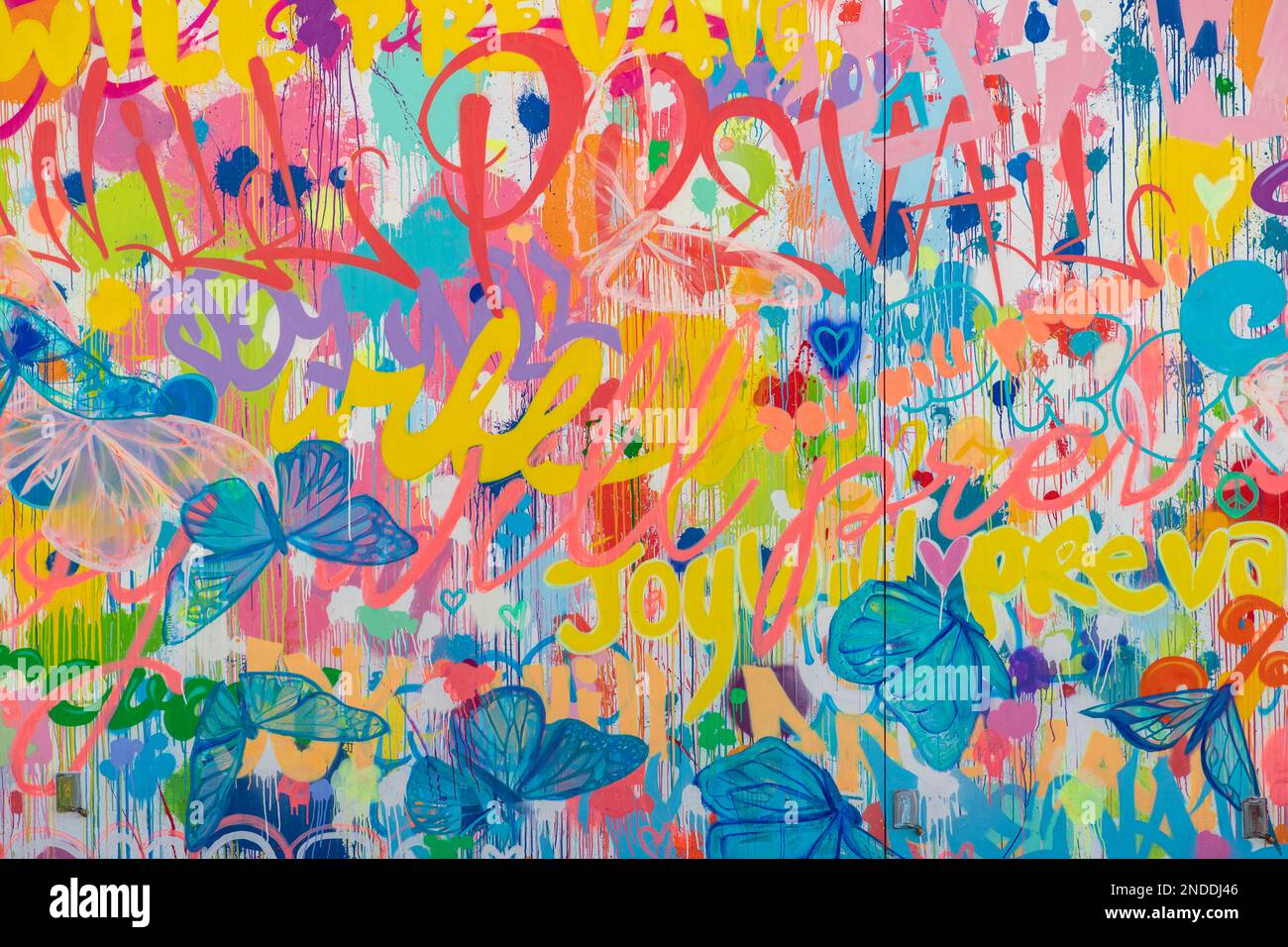A close-up picture of the colorful Joy Will Prevail mural, on the premises of the AKA West Hollywood Hotel, created by Kenyan Armitage in 2022. Stock Photo