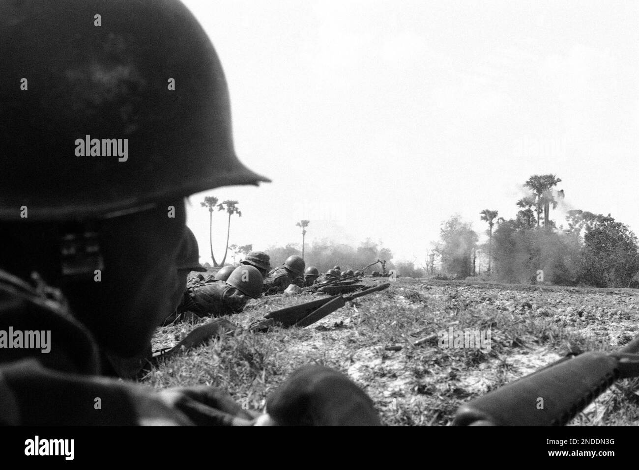 South Vietnamese rangers hug the ground as they encircle a Viet Cong ...