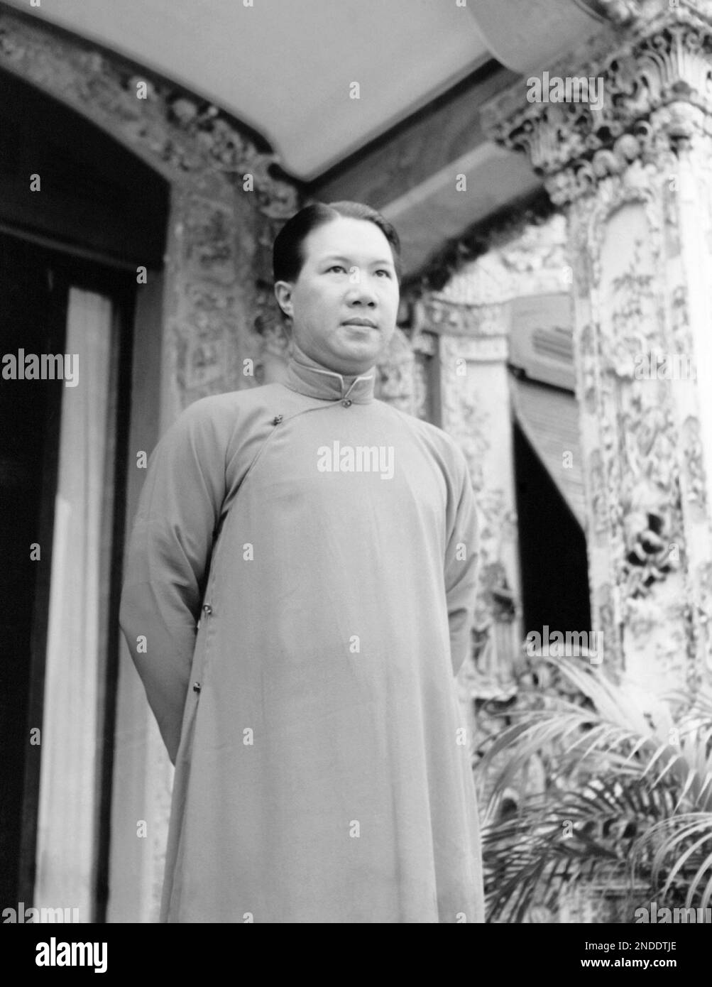 The Seldomphotographed emperor of Annam, Bao Dai, appears in the doorway of his palace in Hue
