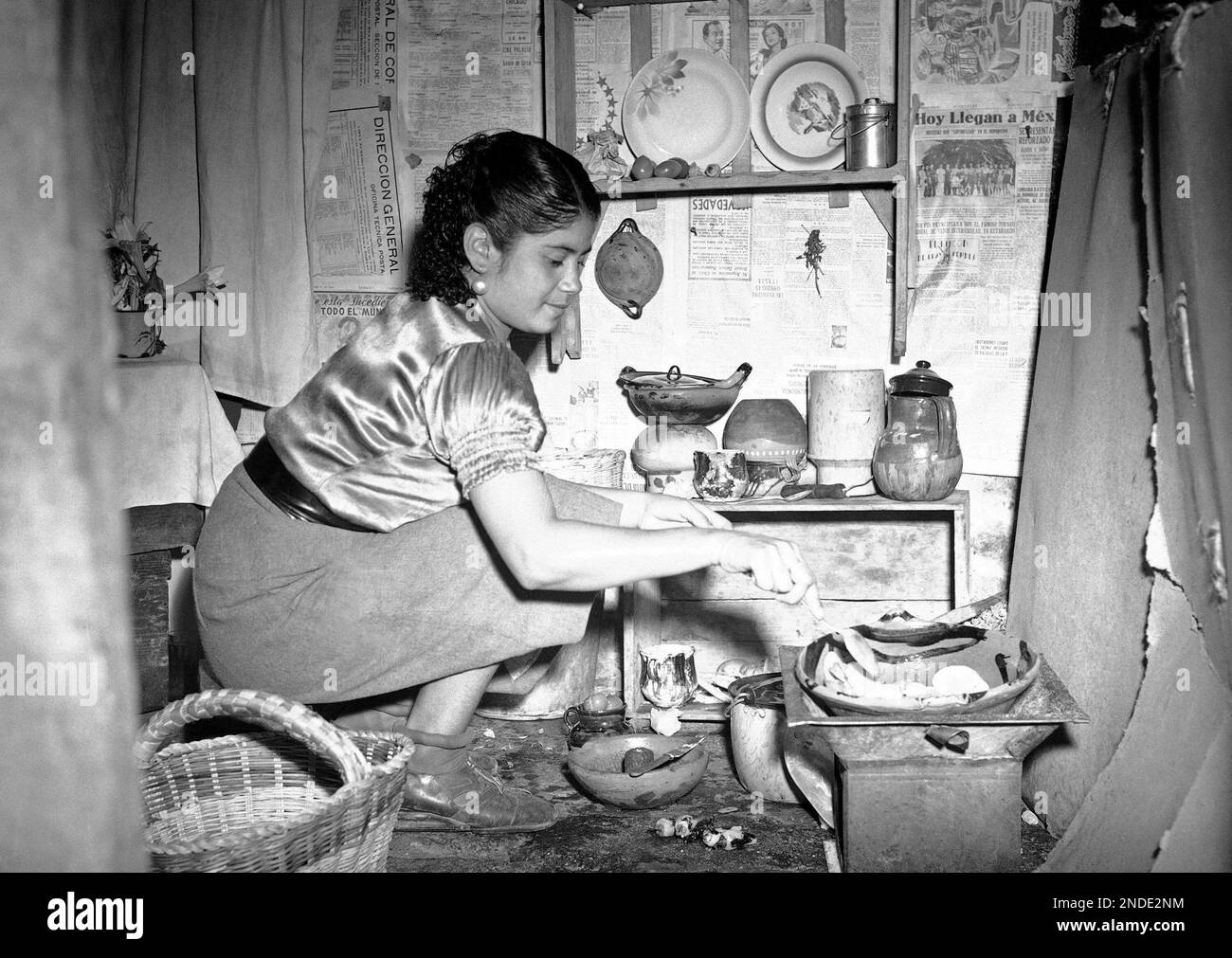 A Mexican soldier’s wife cooking in a military camp in Mexico on May 10, 1941. (AP Photo/Julio Leon) Stock Photo