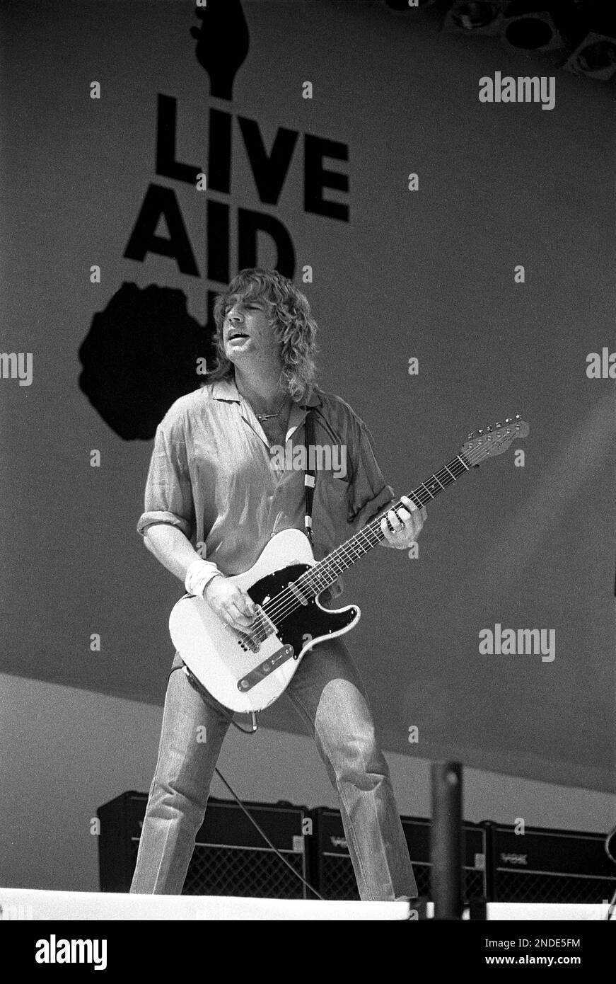Status Quo are the first band on stage at Live Aid on 13 July 1985 at