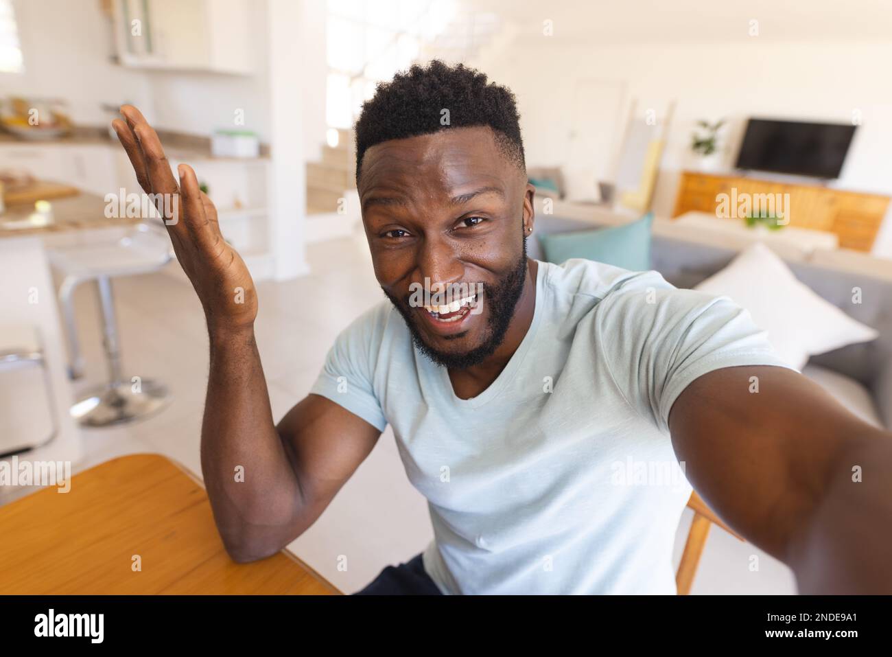 African american man sitting table hi-res stock photography and images ...