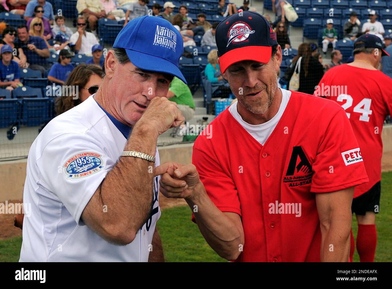 Former Major League Baseball player Steve Garvey, left, shows off his famous forearm as actor