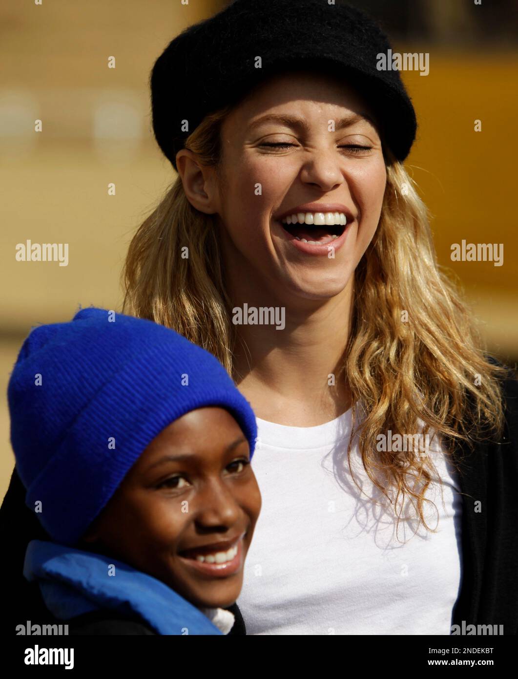 Colombian singer Shakira, right, poses for a photograph with Nthabiseng