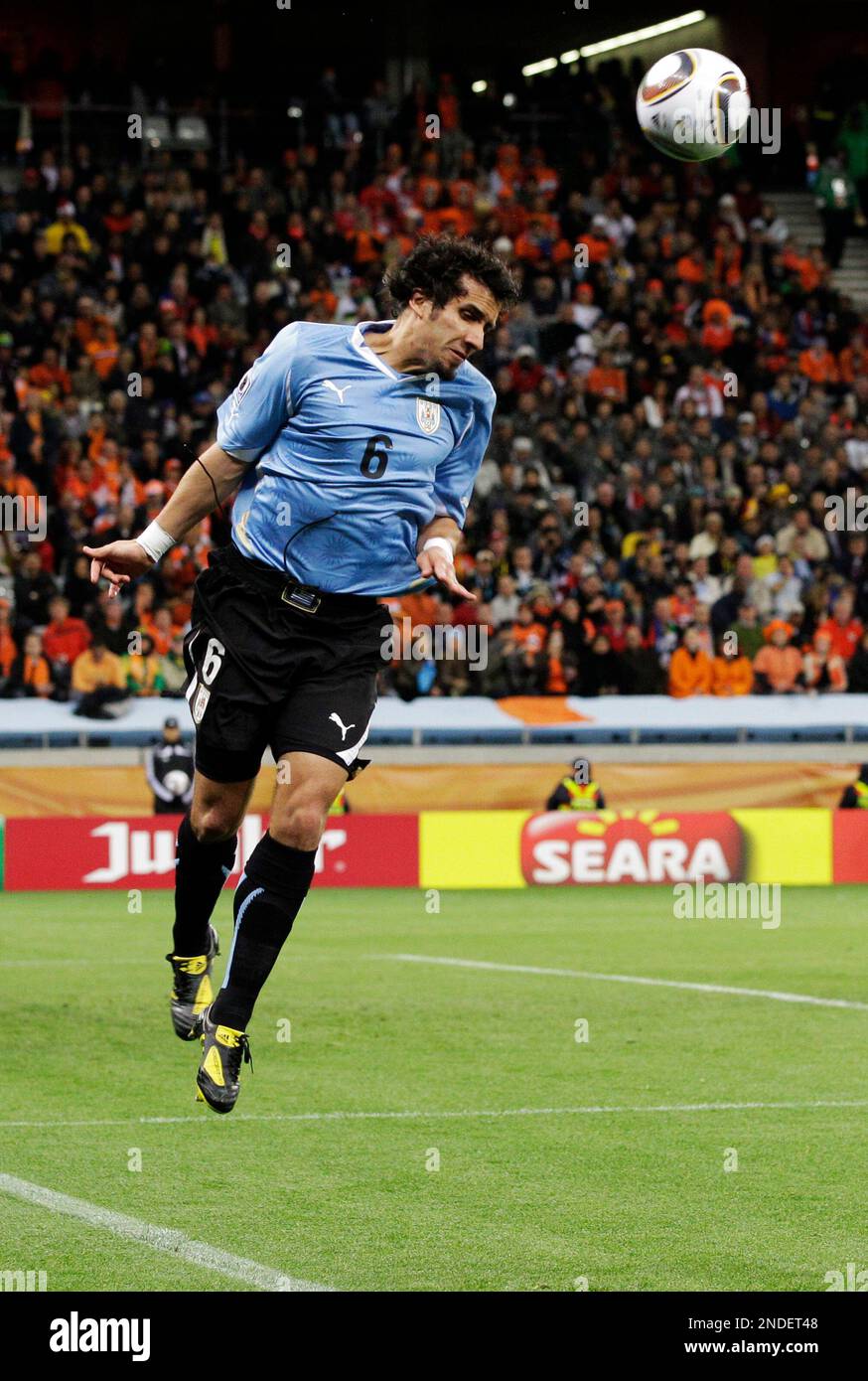 Uruguay's Mauricio Victorino during the World Cup semifinal soccer match between Uruguay and the Netherlands at the Green Point stadium in Cape Town, South Africa, Tuesday, July 6, 2010. (AP Photo/Schalk van Zuydam) Stock Photo