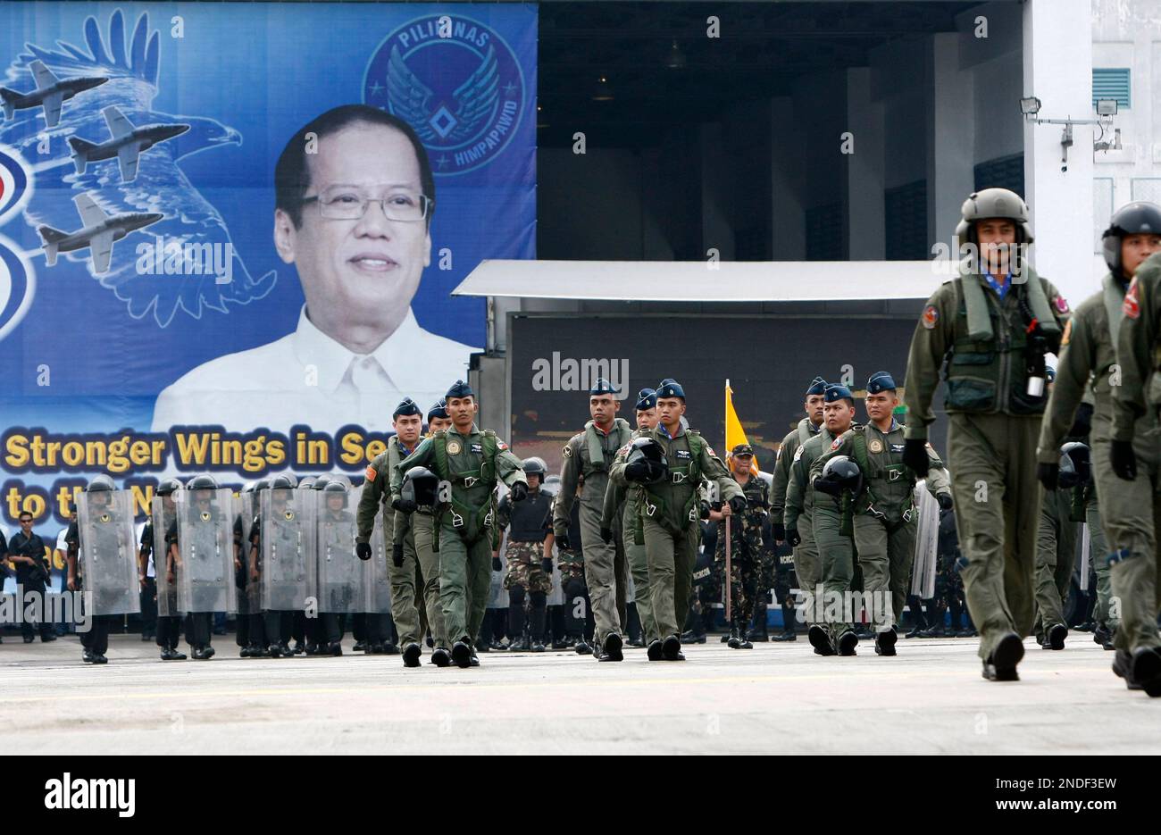 Philippine Air Force pilots and personnel march during a paradein