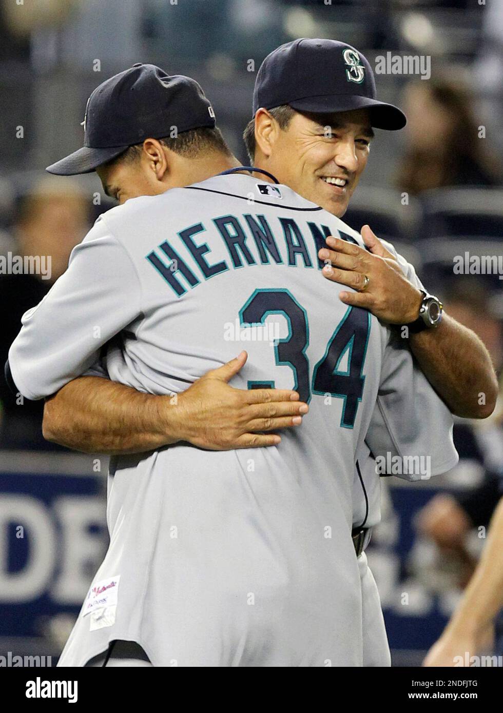 Seattle Mariners' Felix Hernandez, left, hugs manager Don Wakamatsu after  the baseball game against the New York Yankees Wednesday, June 30, 2010, at  Yankee Stadium in New York. Hernandez pitched a complete
