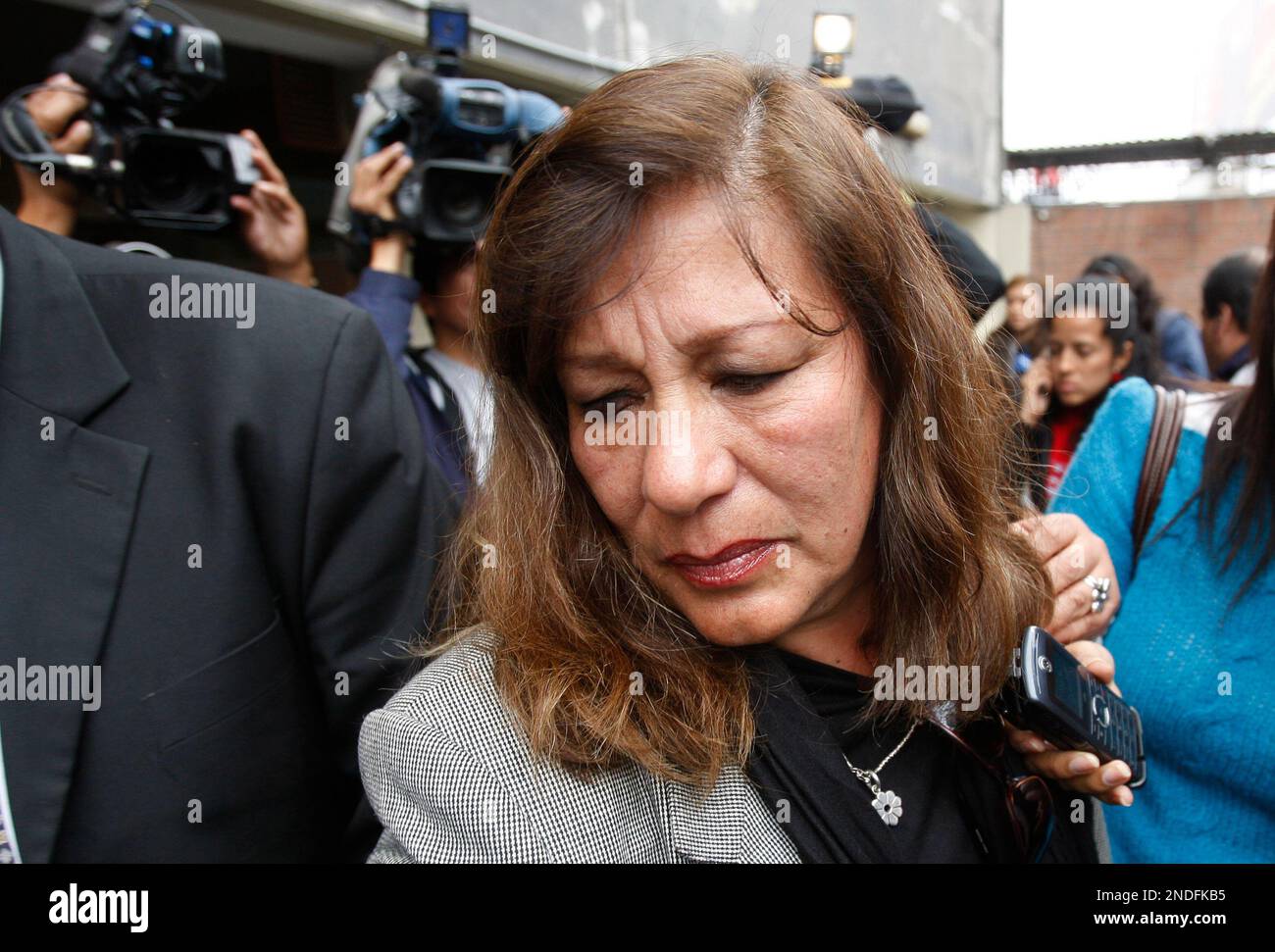 Elvira Pelaez, sister of Vicky Pelaez, leaves after a press conference at RPP radio station in Lima, Wednesday, June 30, 2010. Peruvian journalist Vicky Pelaez was among 10 people arrested in a sweep in the United States on June 27 as part of an alleged Russian spy ring and charged with conspiracy to act as an agent of a foreign government without notifying the U.S. Attorney General, which carries a maximum penalty of five years in prison upon conviction. (AP Photo/Karel Navarro) Stock Photo