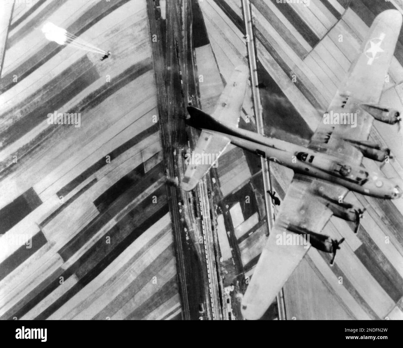 two-b-17-crew-members-upper-left-parachute-from-their-burning-plane