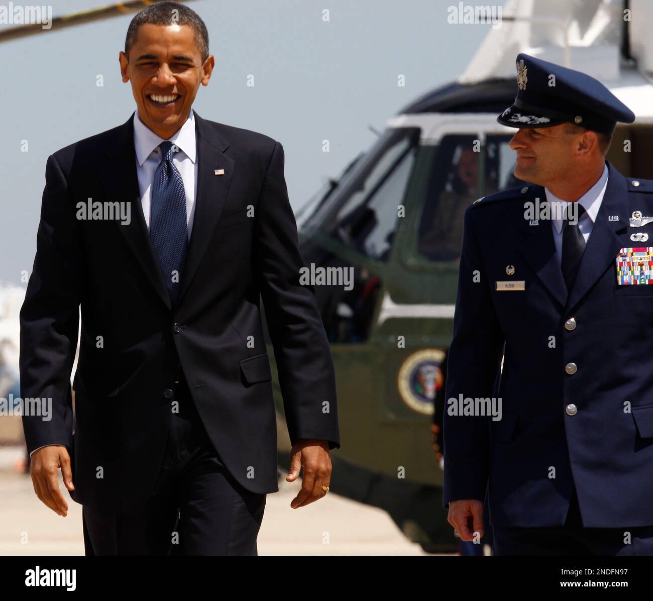 President Barack Obama walks with Col. Kenneth R. Rizer, Commander of ...