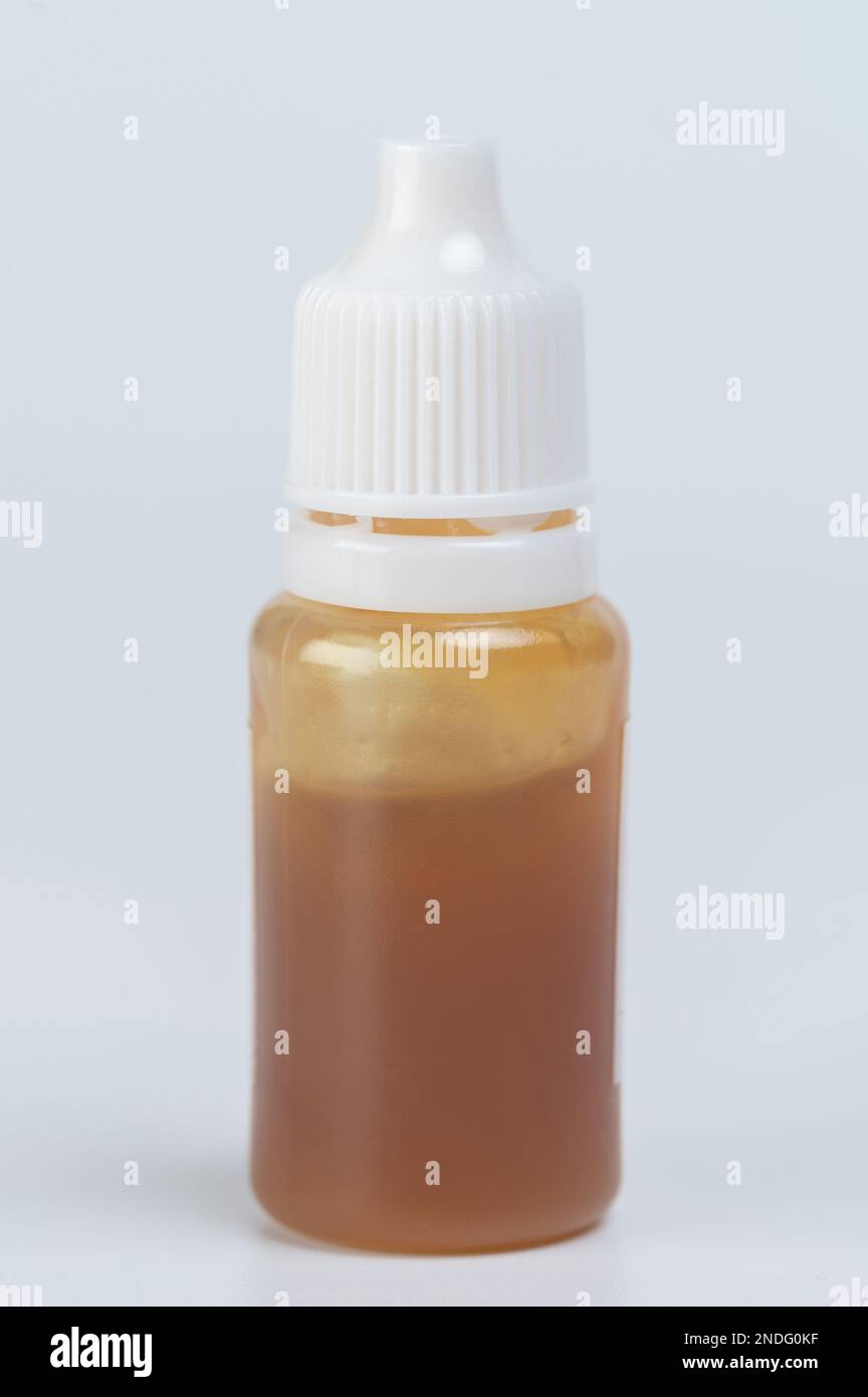 One bottle with grease oil isolated on white studio background Stock