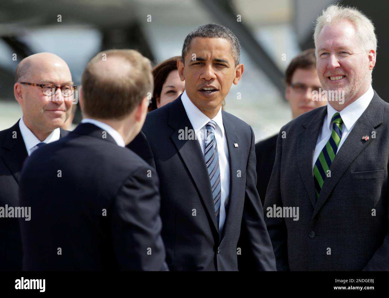 President Barack Obama of the United States is greeted on the tarmac by ...