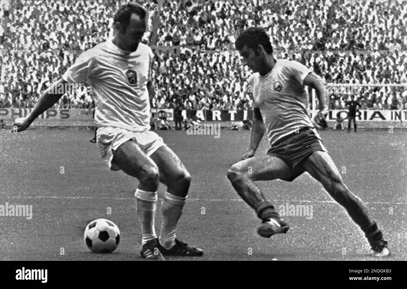 Romania’s Alexandru Neagu, right, dribbles past Czechoslovakia’s Vaclav Migas, to score Romania