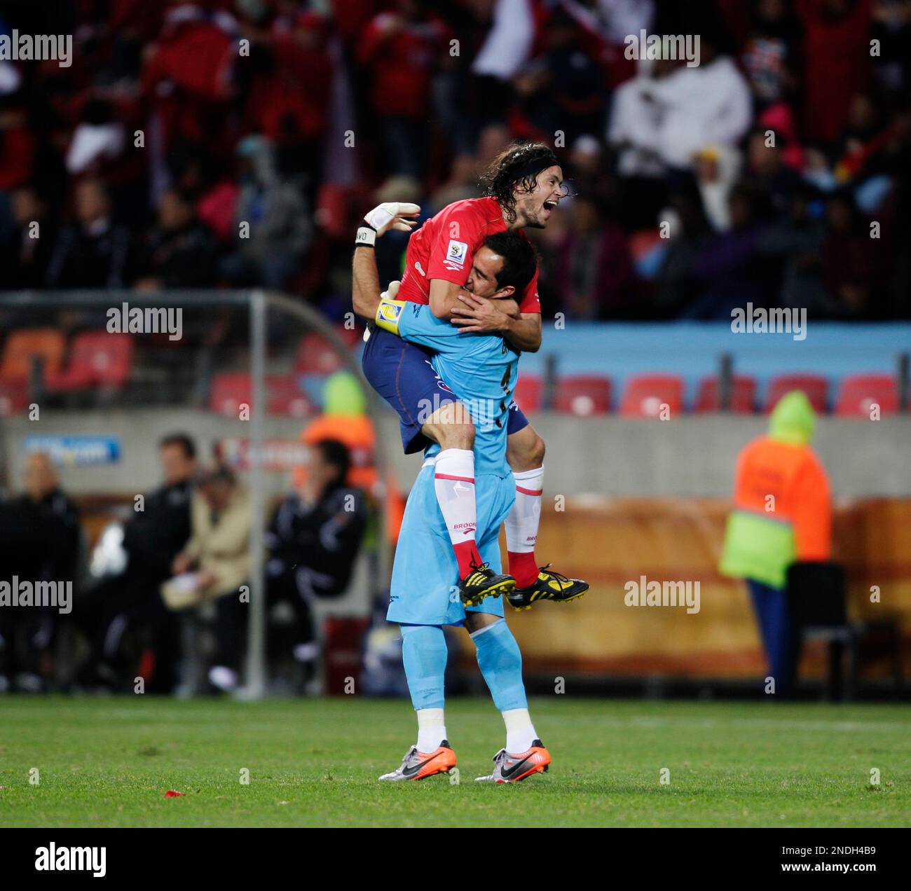 Chile goalkeeper Claudio Bravo, right, and Chile's Waldo Ponce, left ...