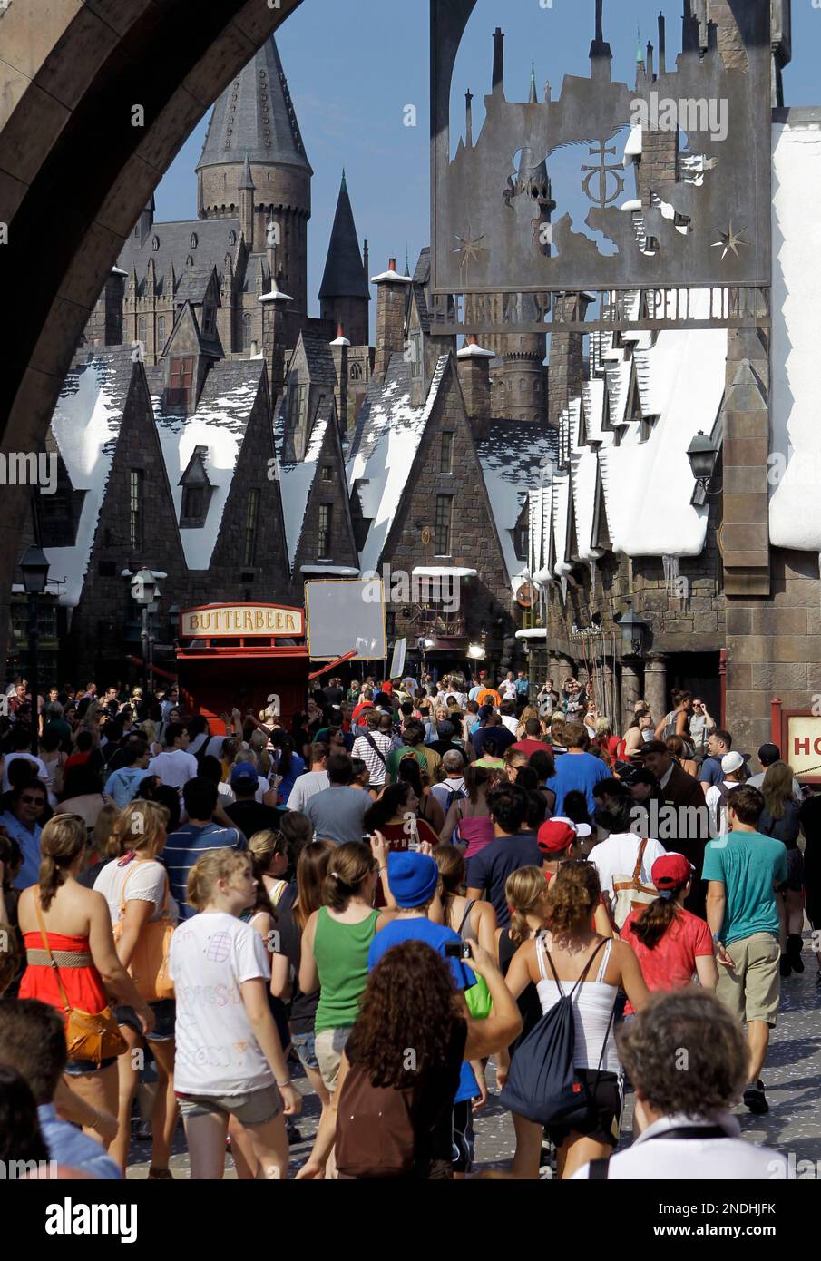 Guests enter the Wizarding World of Harry Potter during the grand opening at Universal Orlando