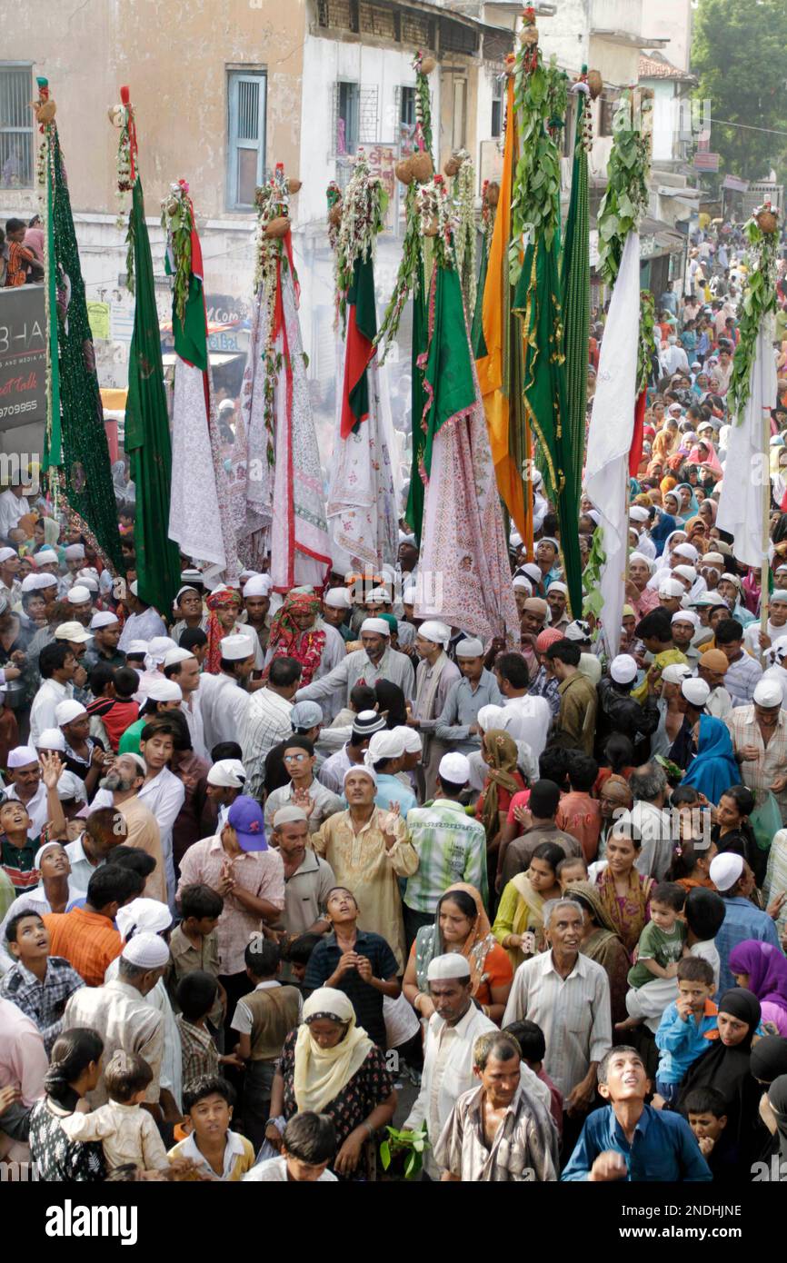 Indian pilgrims participate in a procession to visit a shrine, in ...