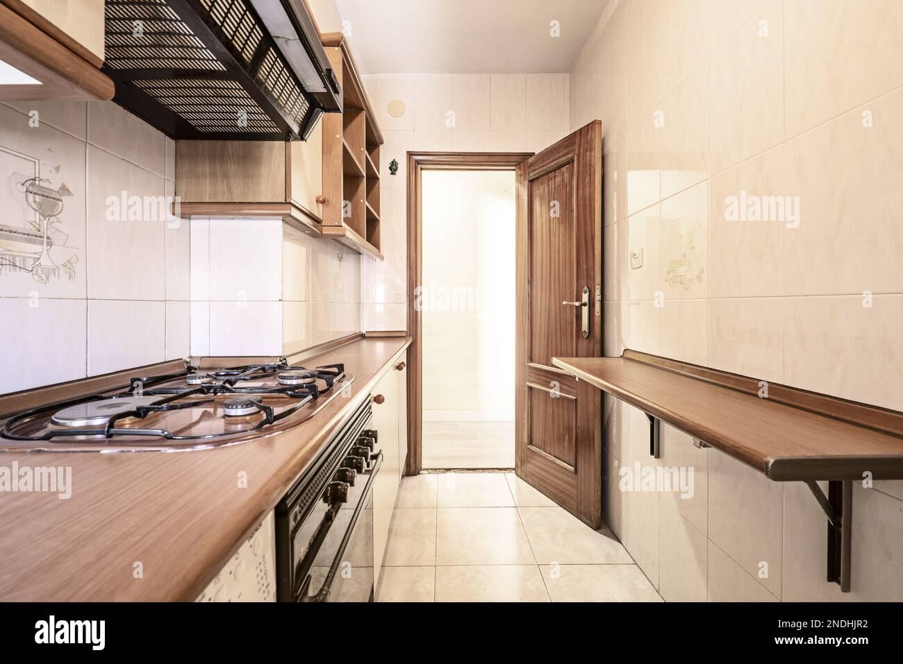 Small kitchen with light wood with steel and wood accents on