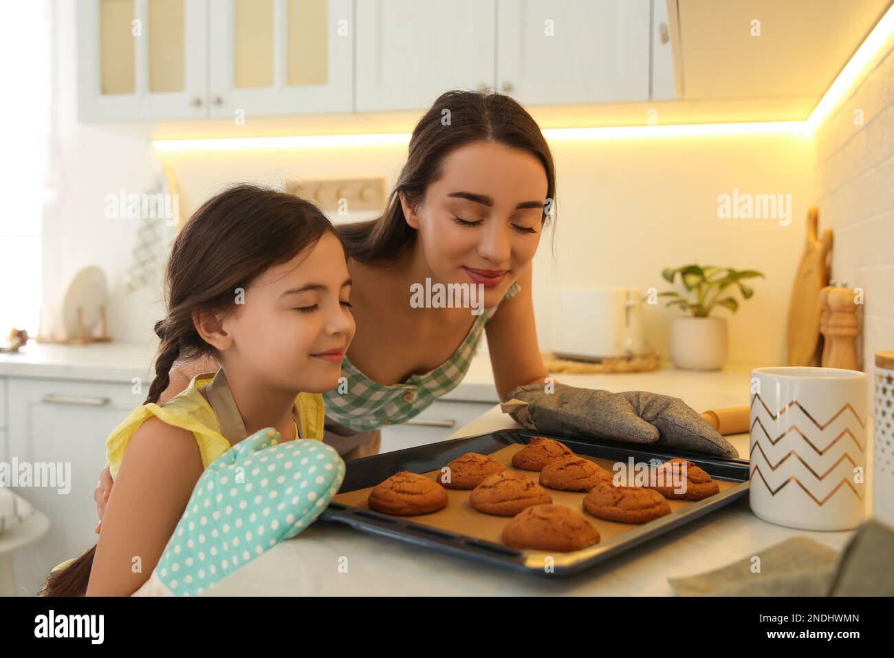 Woman smelling baked cookies hires stock photography and images Alamy