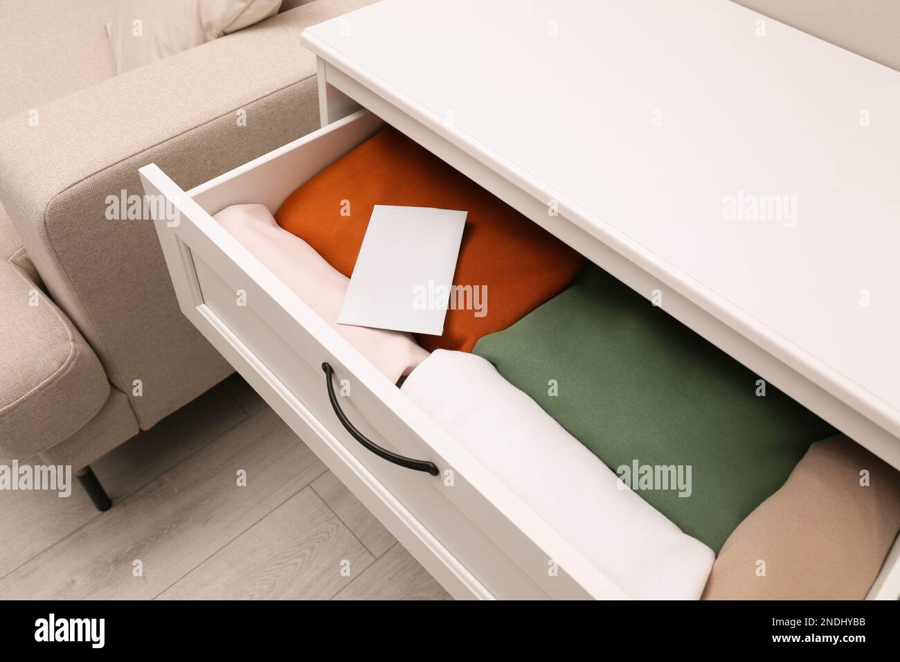 Scented sachet and folded clothes in drawer Stock Photo Alamy