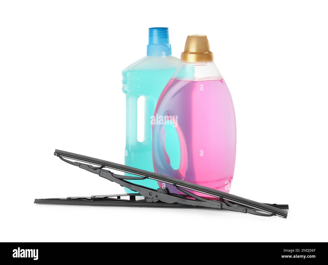 Bottles of windshield washer fluids and wipers on white background