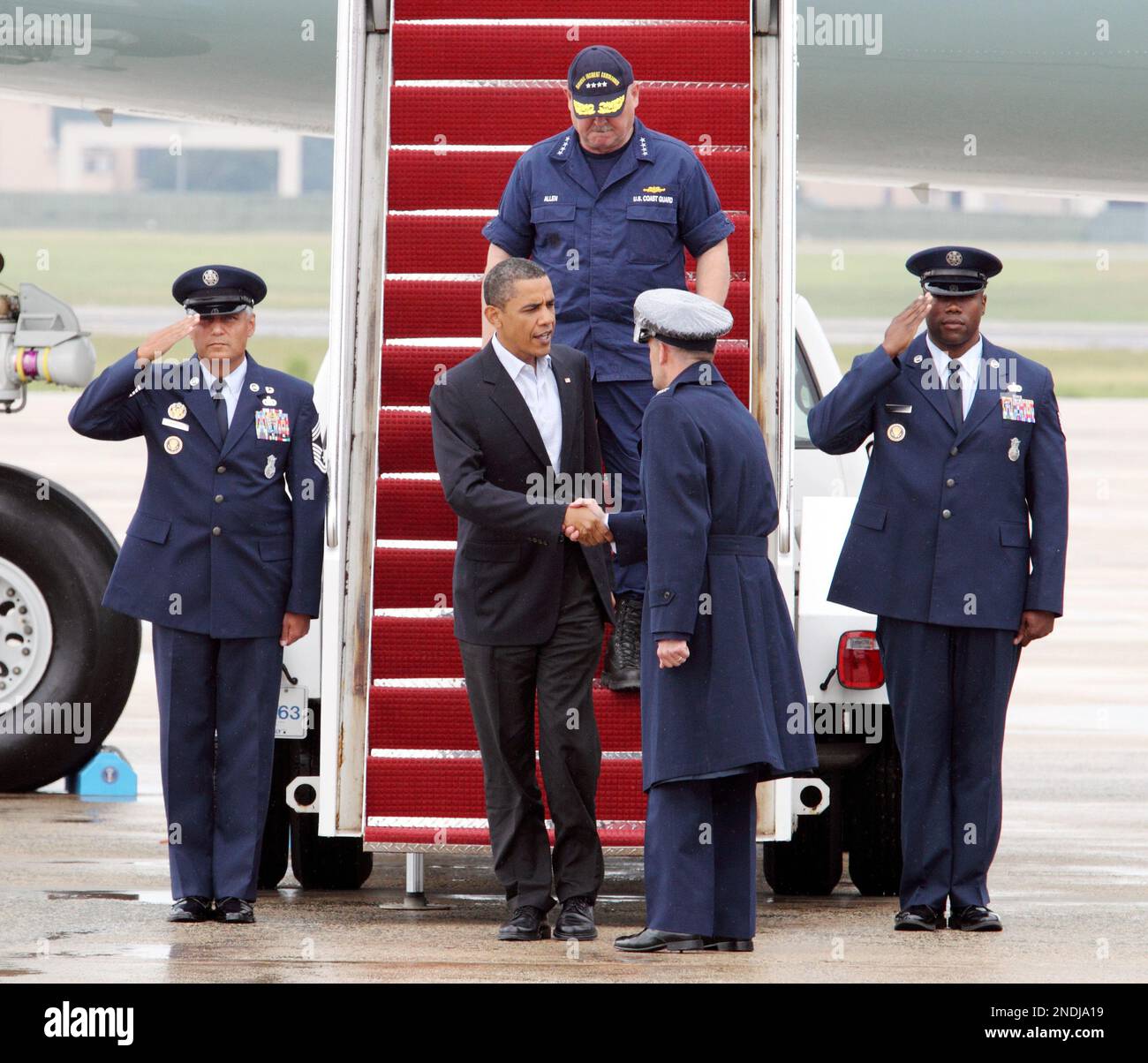 President Barack Obama shake hands Andrews Air Force Base Commander Col ...