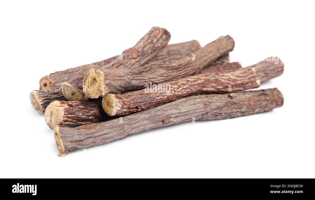 Dried sticks of liquorice root on white background Stock Photo