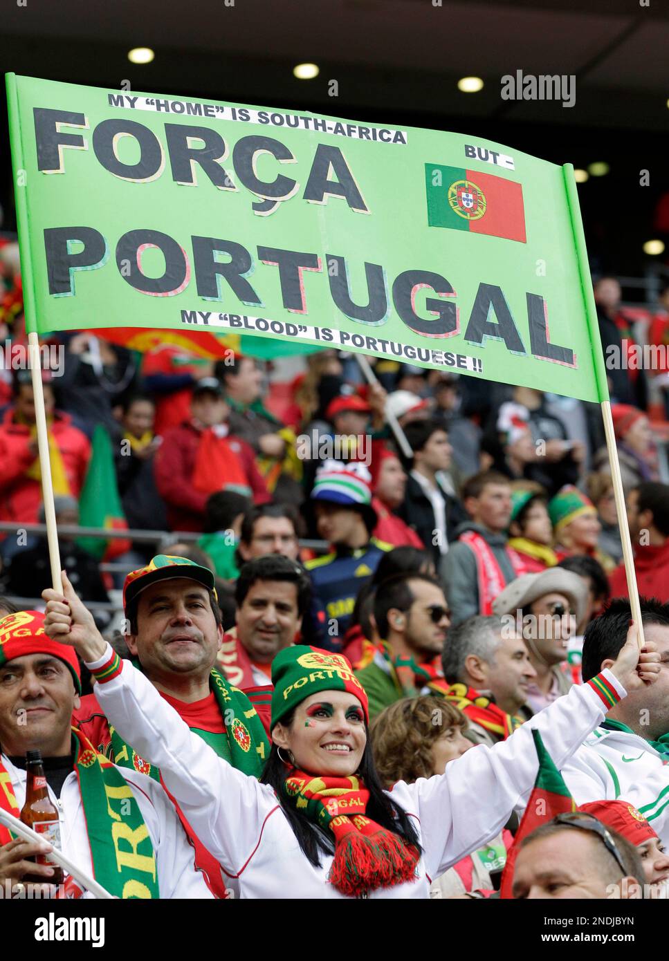 Portuguese fans cheer during the World Cup group G soccer match between