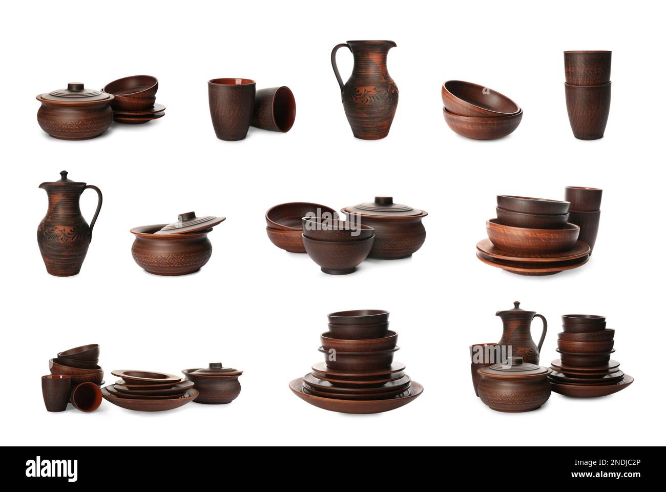 Set with clay dishes on white background Stock Photo - Alamy