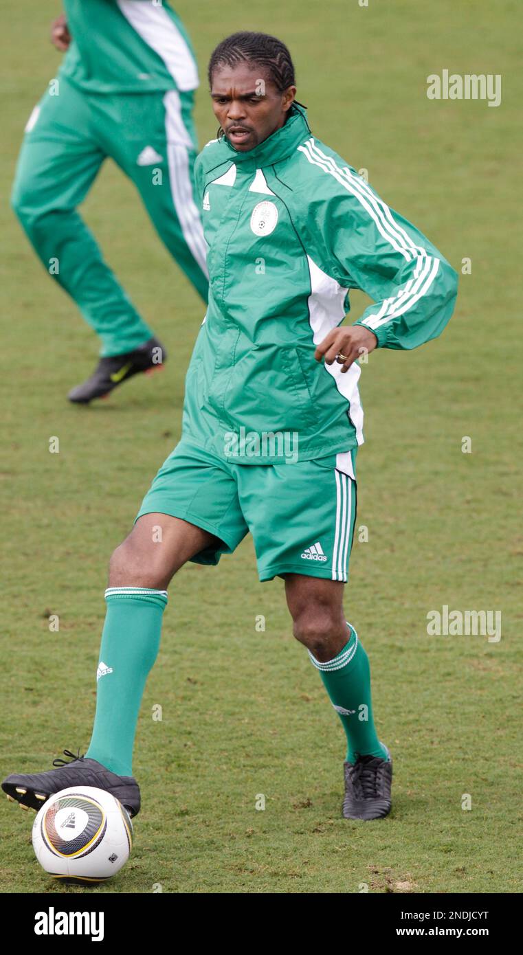 Nigeria's Nwankwo Kanu passes the ball during his teams soccer training ...