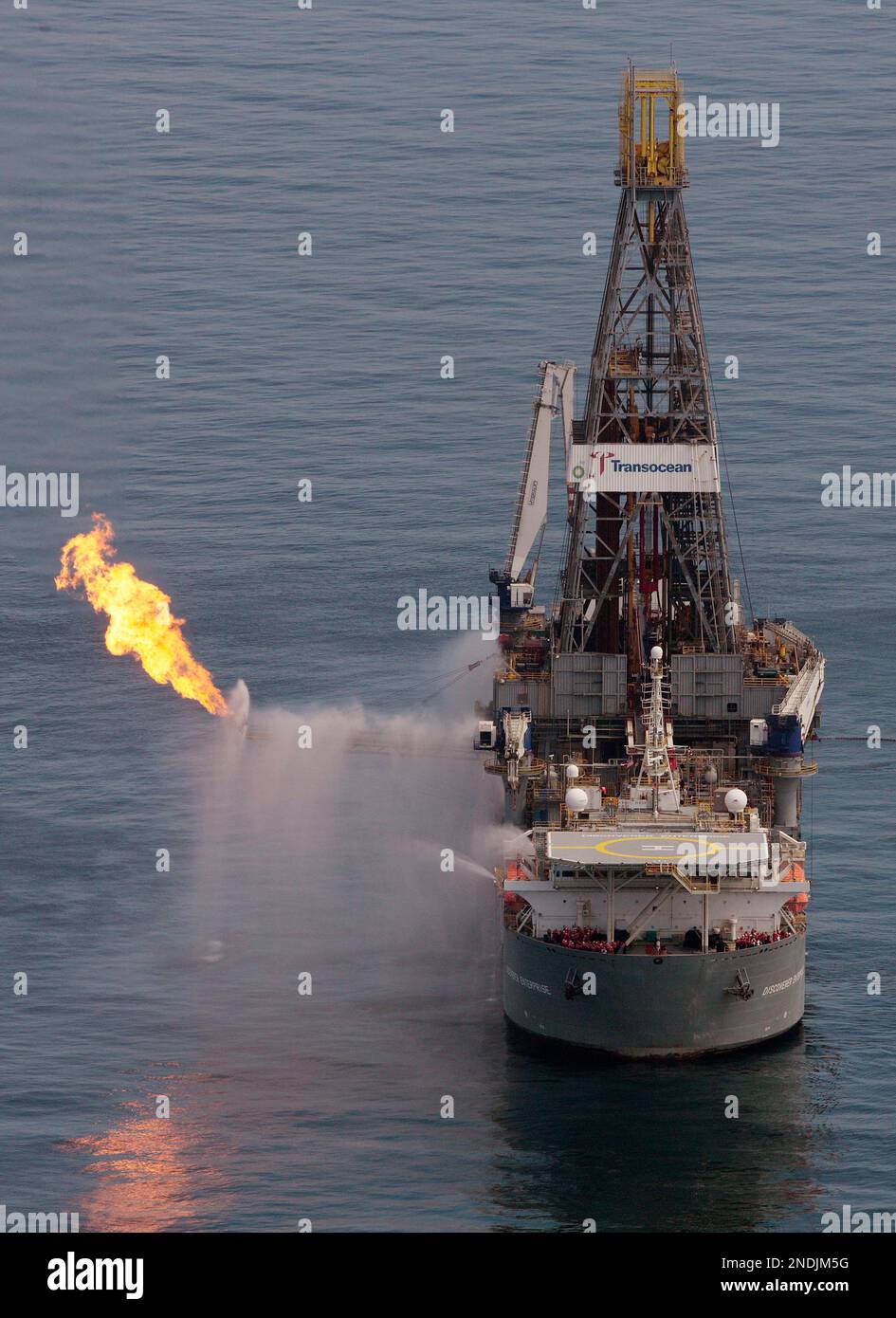 The Transocean Deepwater Discoverer drilling rig operates over the site ...