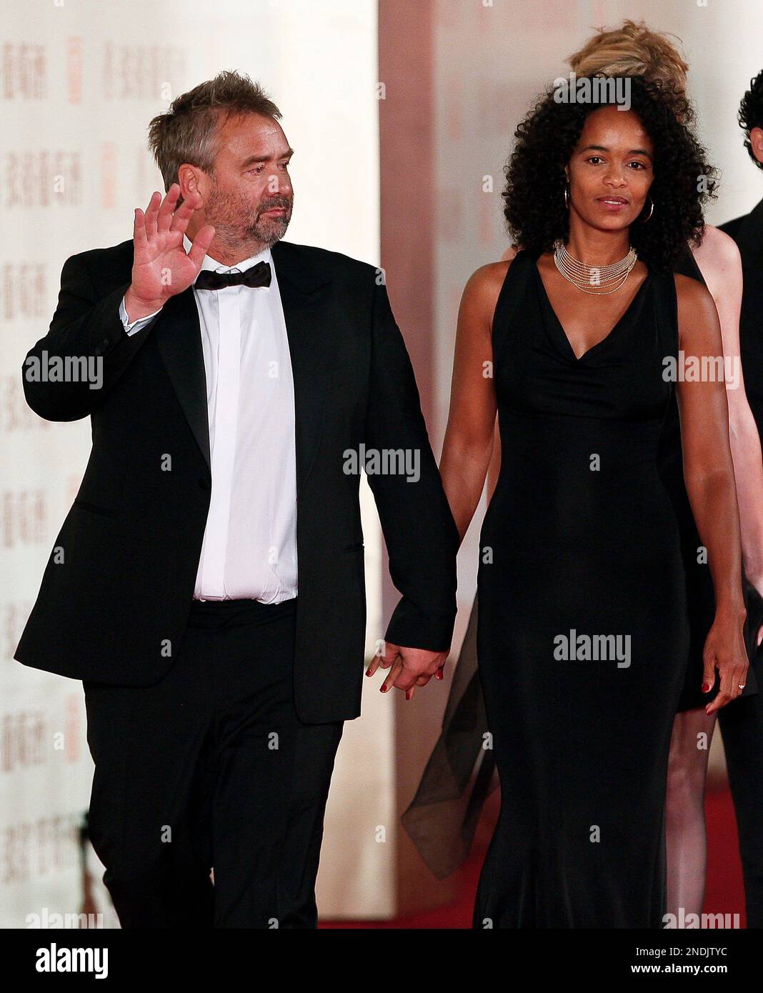 French director Luc Besson, left, and his wife Virginie Silla arrive at ...