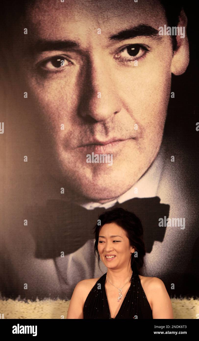 Chinese actress Gong Li, front center, Yves Carcelle, front second