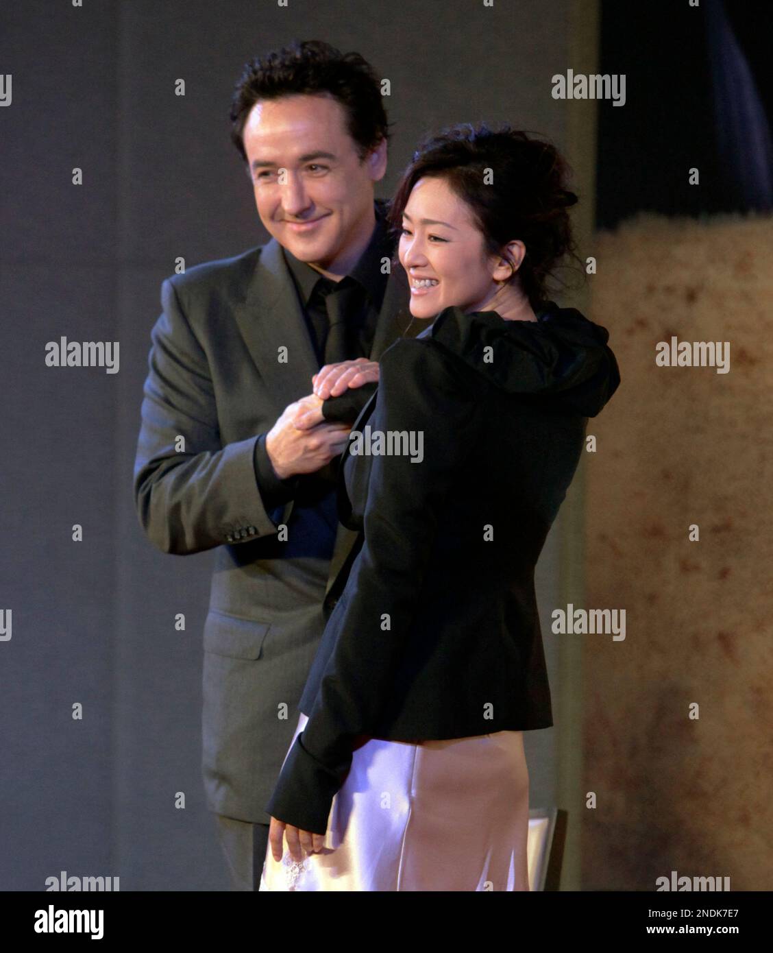 american-actor-john-cusack-left-and-chinese-actress-gong-li-pose-for