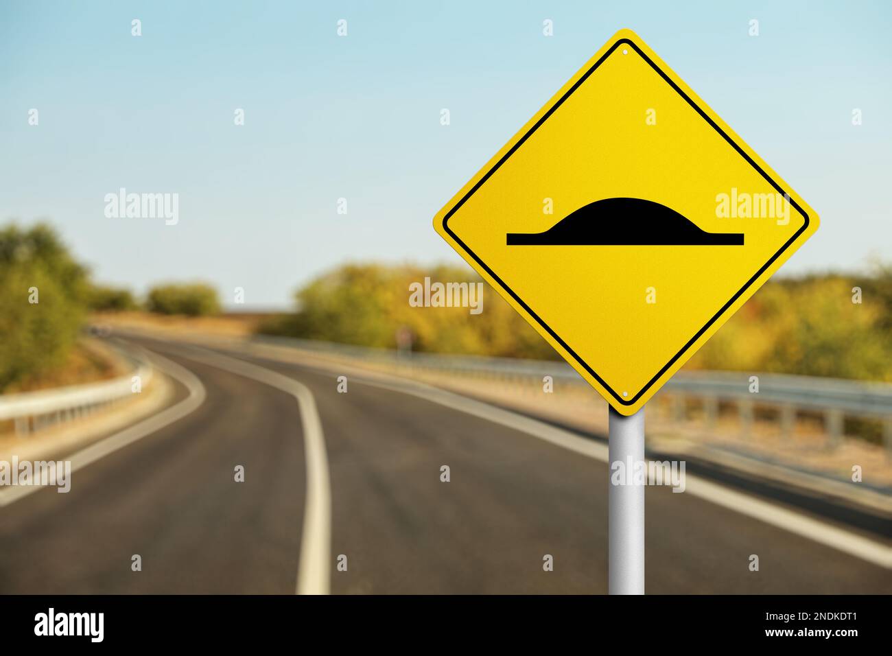 Sign Speed Bump near asphalt road outdoors Stock Photo Alamy
