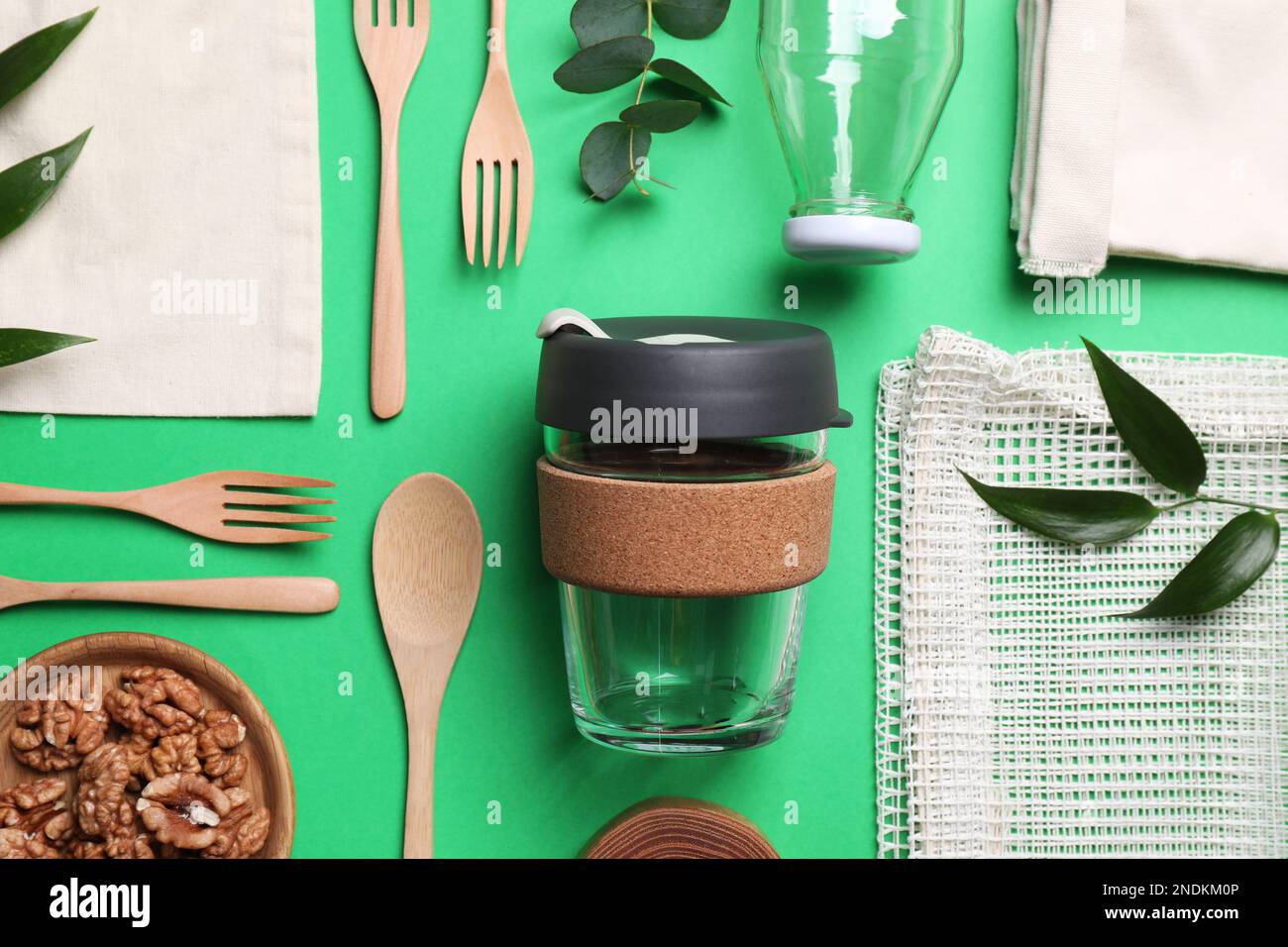 Flat lay composition with eco friendly products on green background ...