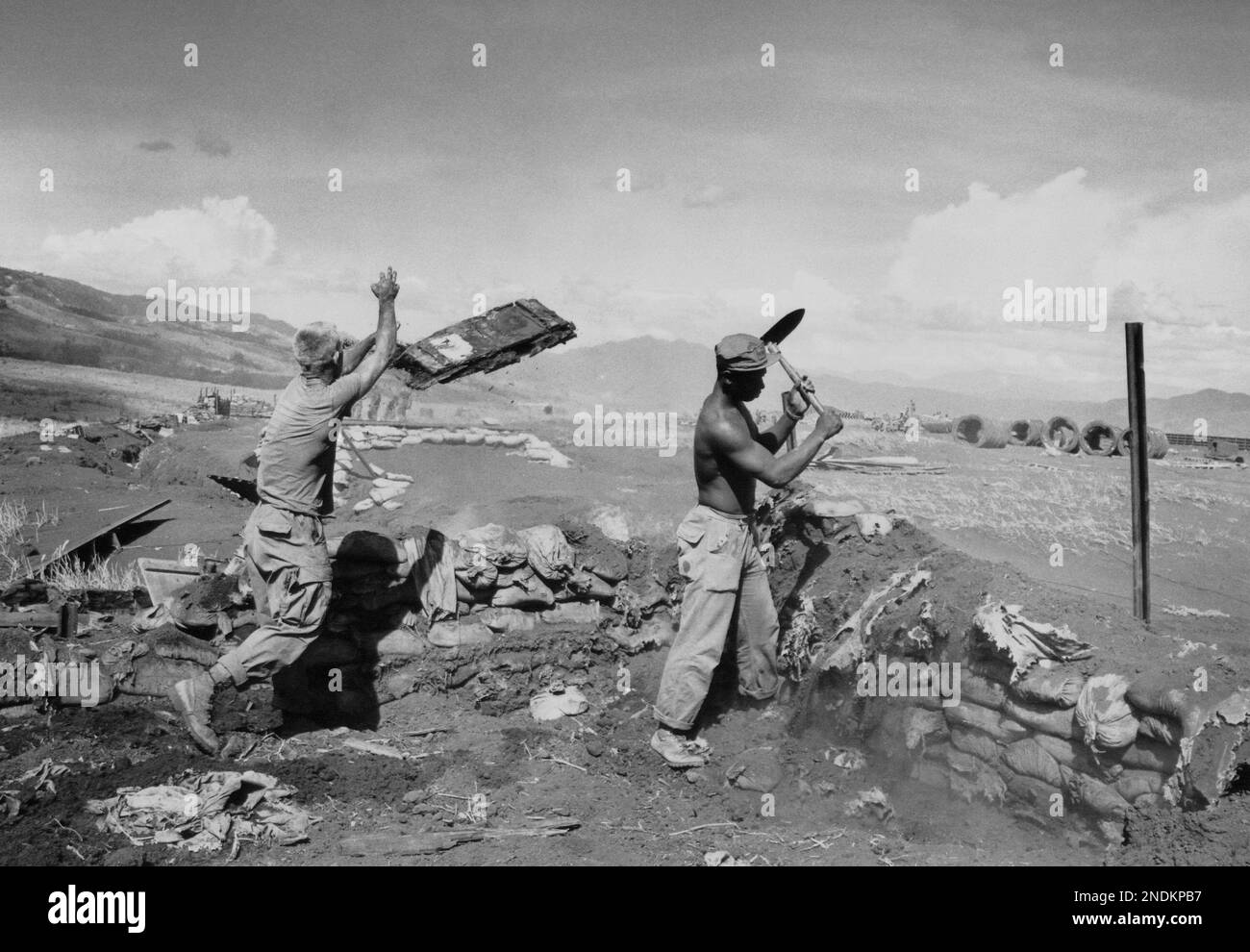 Marines at the base at Khe Sanh in Vietnam, July 3, 1968 are destroying ...