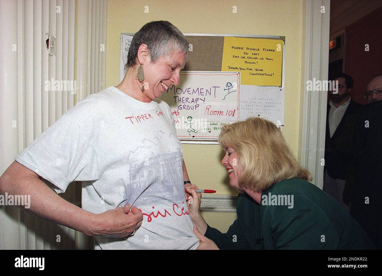Tipper Gore signs the Tshirt of Mary Ellen O’Connor a staff member at