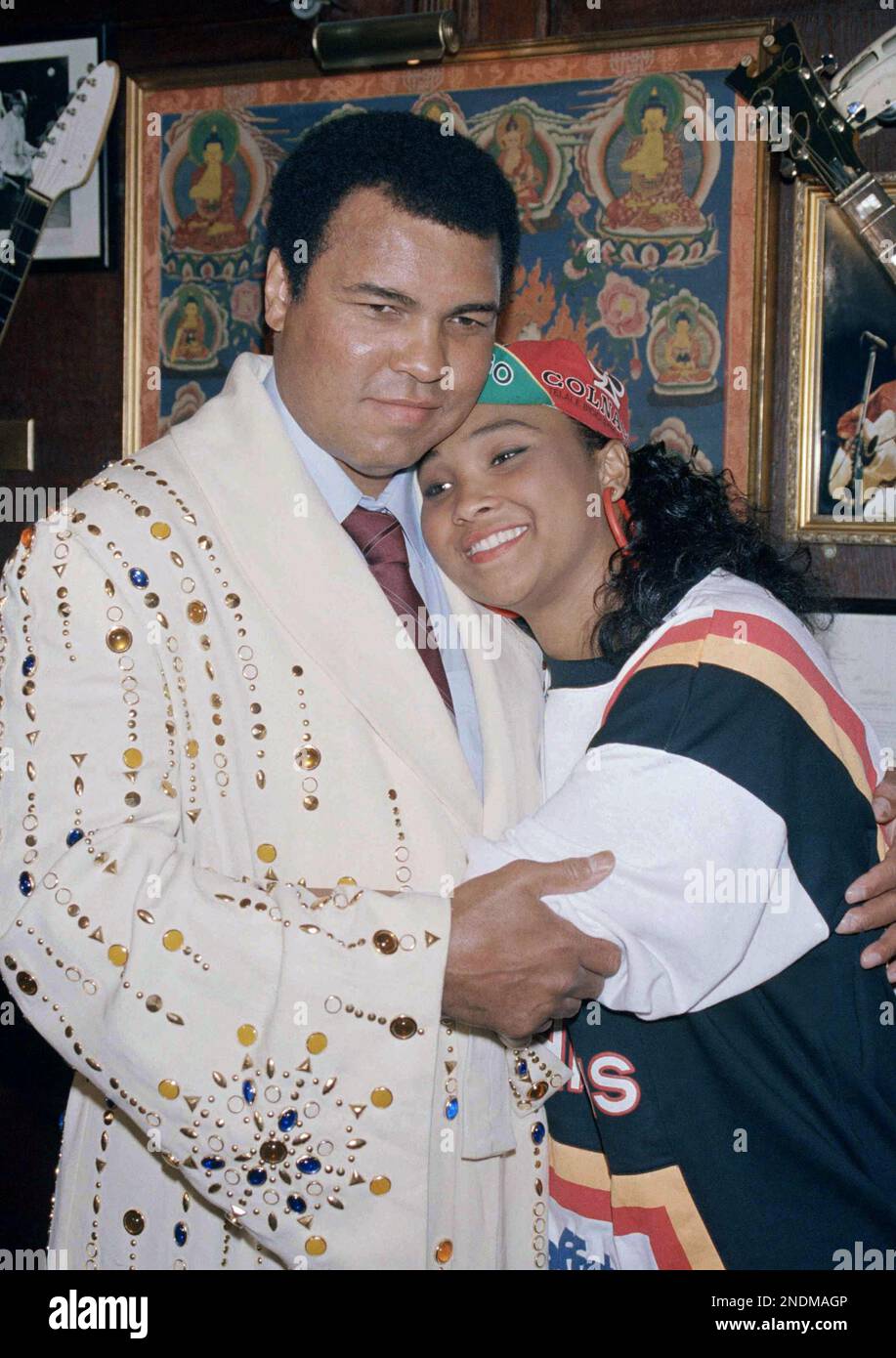 Former Heavyweight champion Muhammad Ali gets a hug from his daughter ...