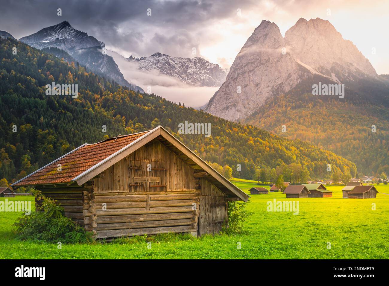 Bavarian alps and rustic farm barns, Garmisch Partenkirchen, Zugspitze ...